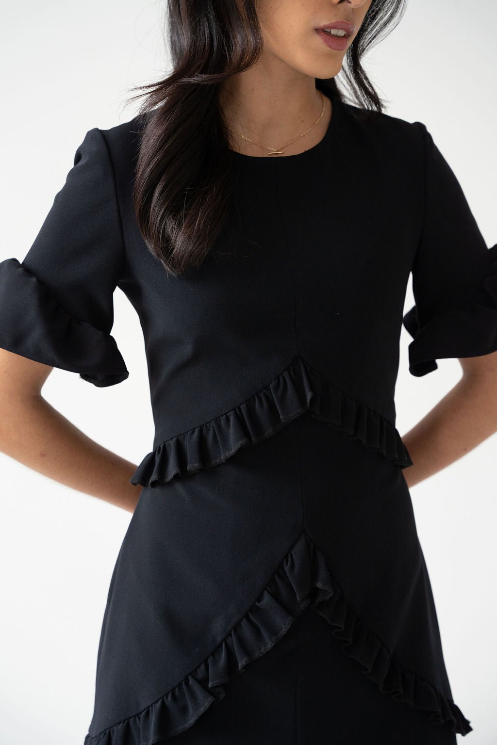 Black crepe ruched mini dress