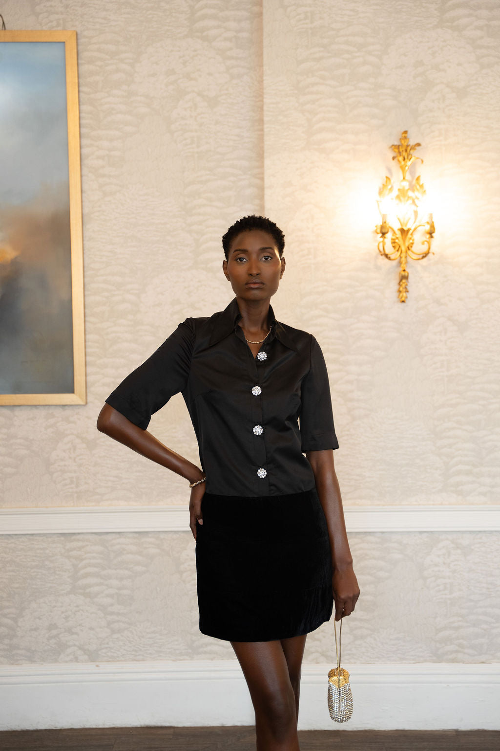 Black satin and velvet short-sleeve dress with button front and fitted waist.