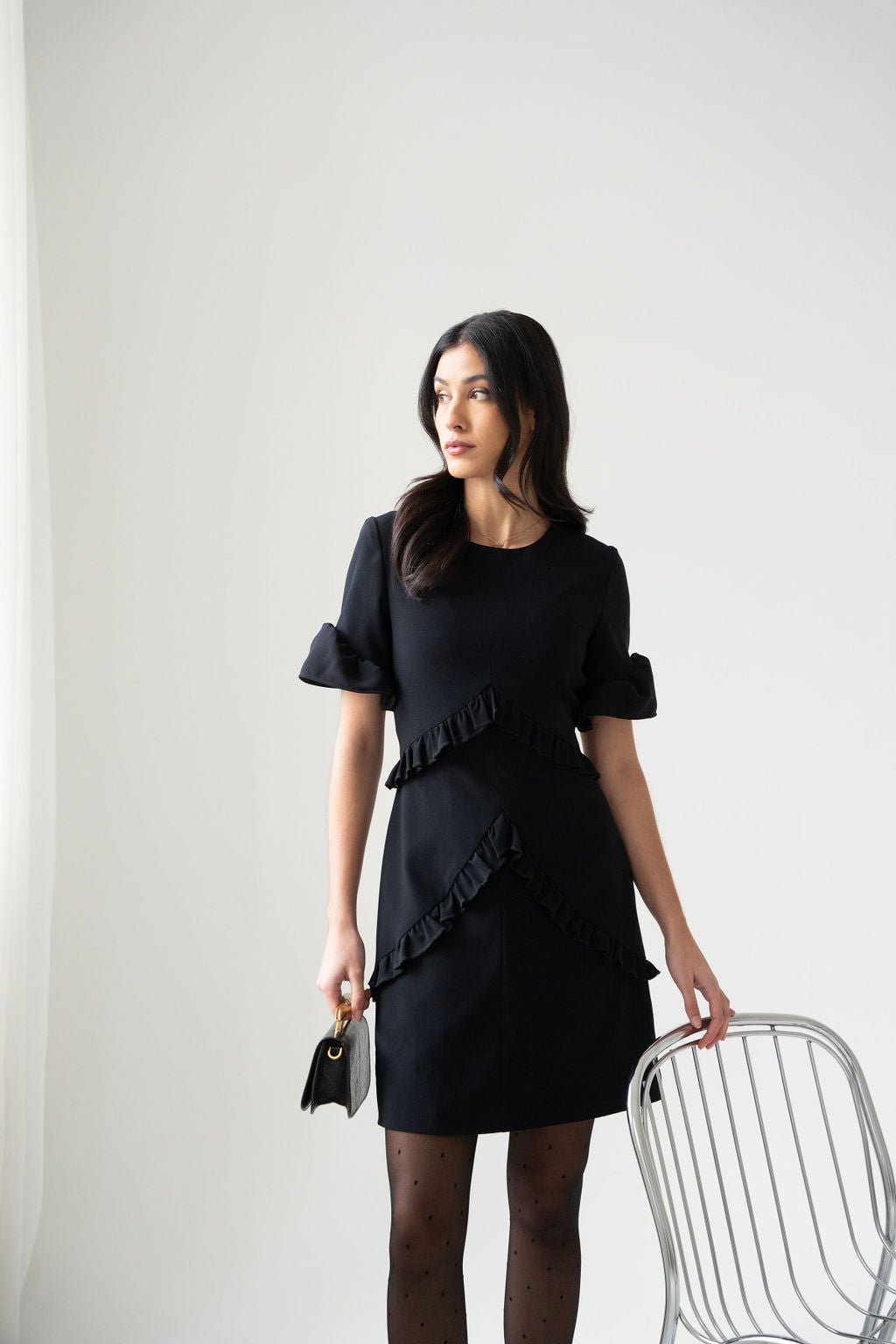 Black crepe ruched mini dress