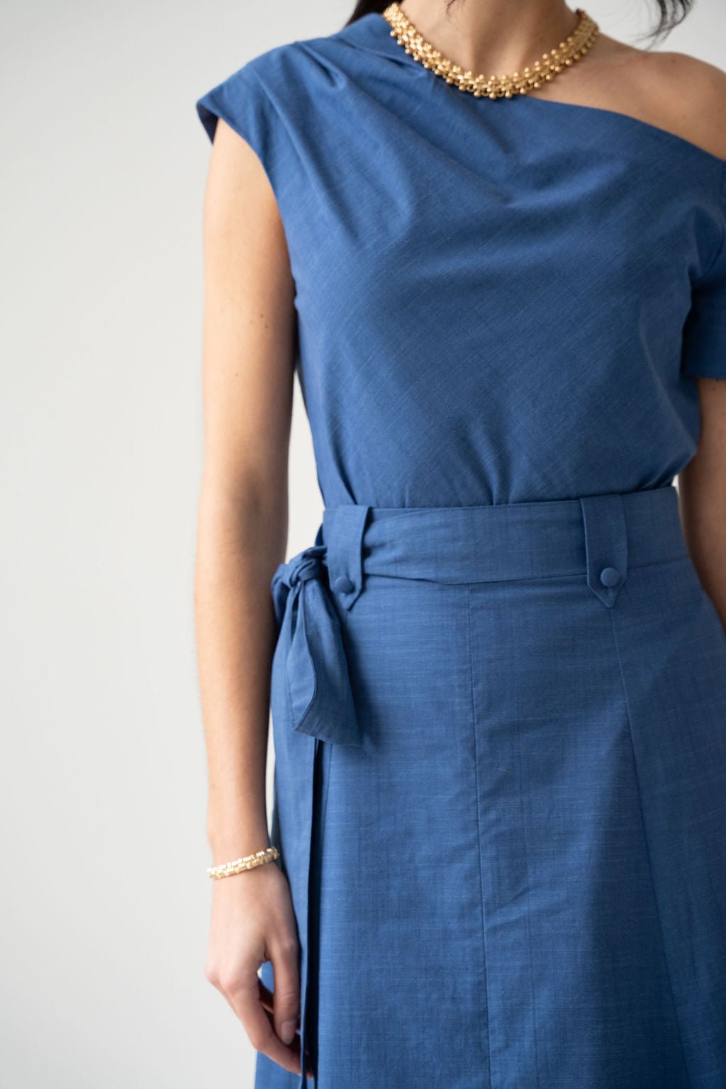 Blue cotton off the shoulder draped top