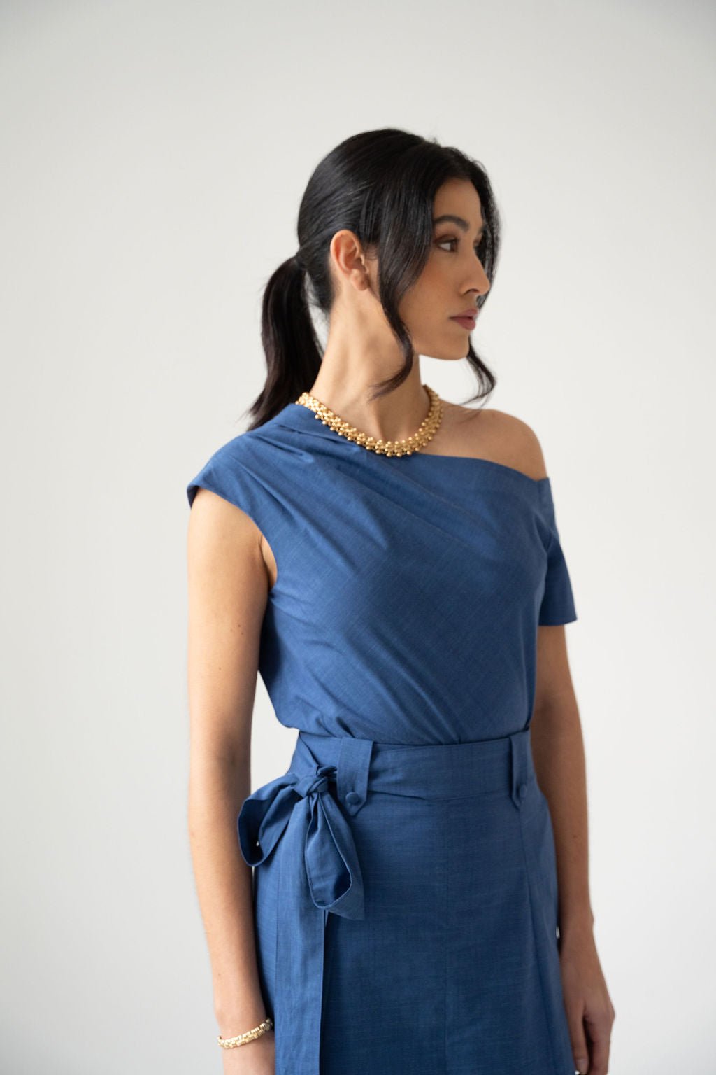 Blue cotton off the shoulder draped top